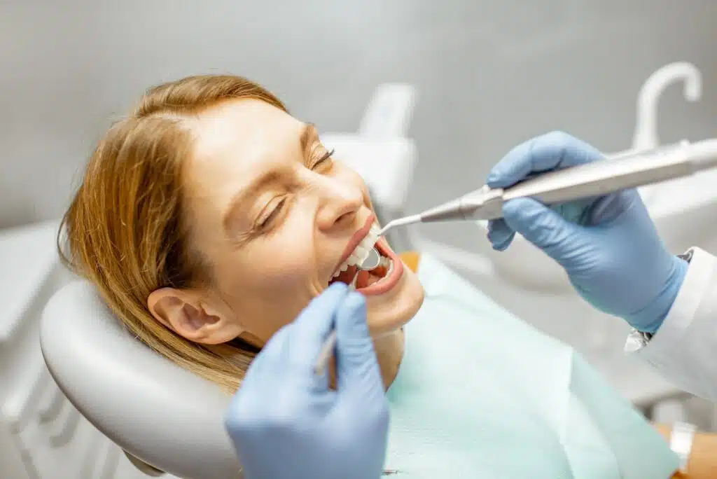 woman during a teeth inspection at the dental office